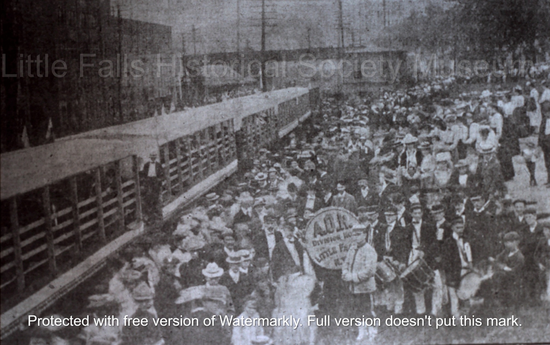 A Labor Day crowd waiting at the Little Falls Train Station to board a train on the Little Falls-Dolgeville line, on a excursion to High Falls Park | c.1890s
