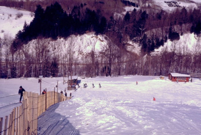 Rope tow ski lift pictured at left from the top of ski ridge at Mohawk Valley Ski Club with Route 168 in background