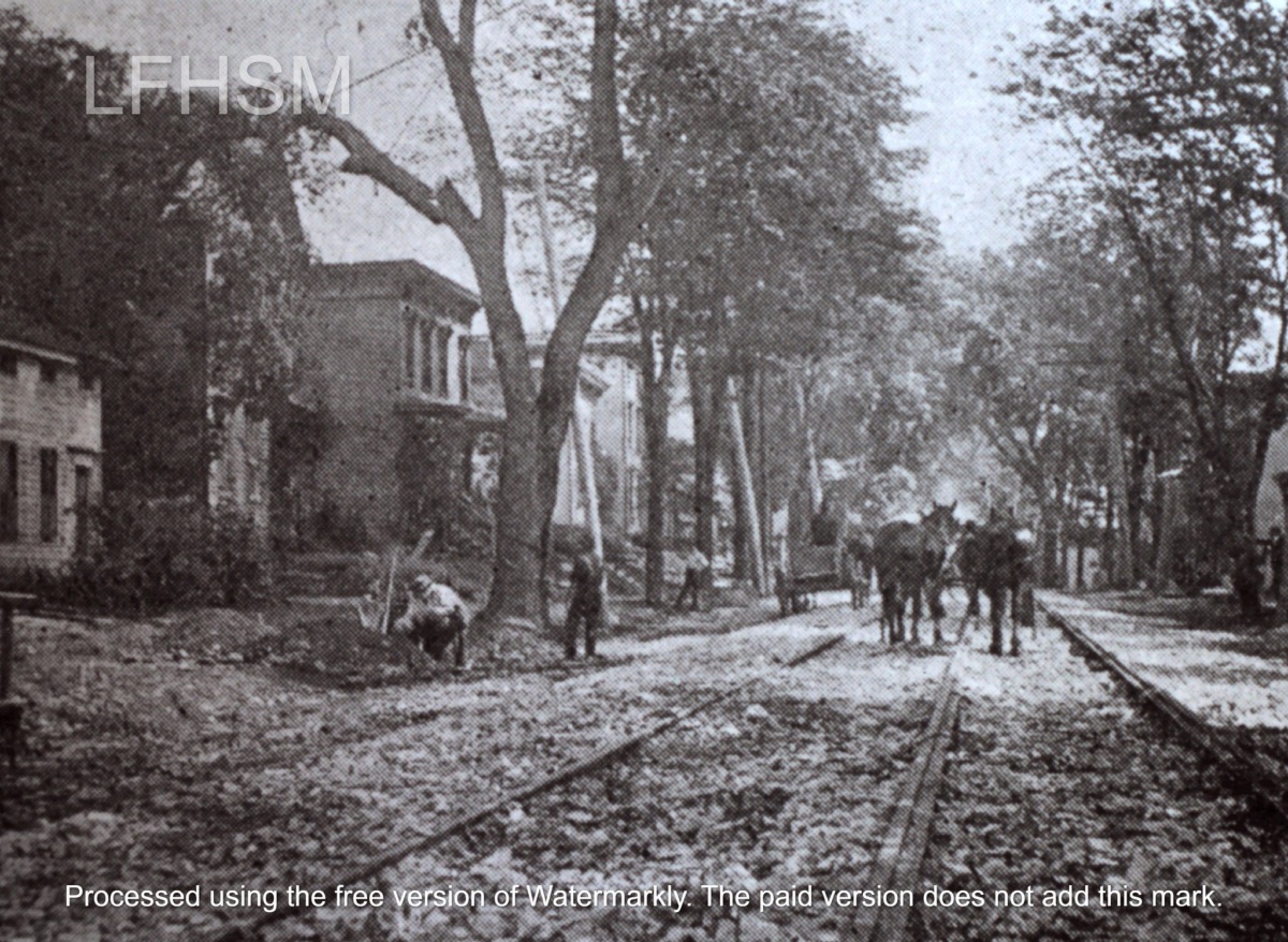 Building the tracks for the electric street trolleys on West Main Street, Little Falls, New York | Circa 1901.
